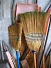 photograph of two brooms in a garbage can garage cheektowaga ny entitled grandma and grandpa